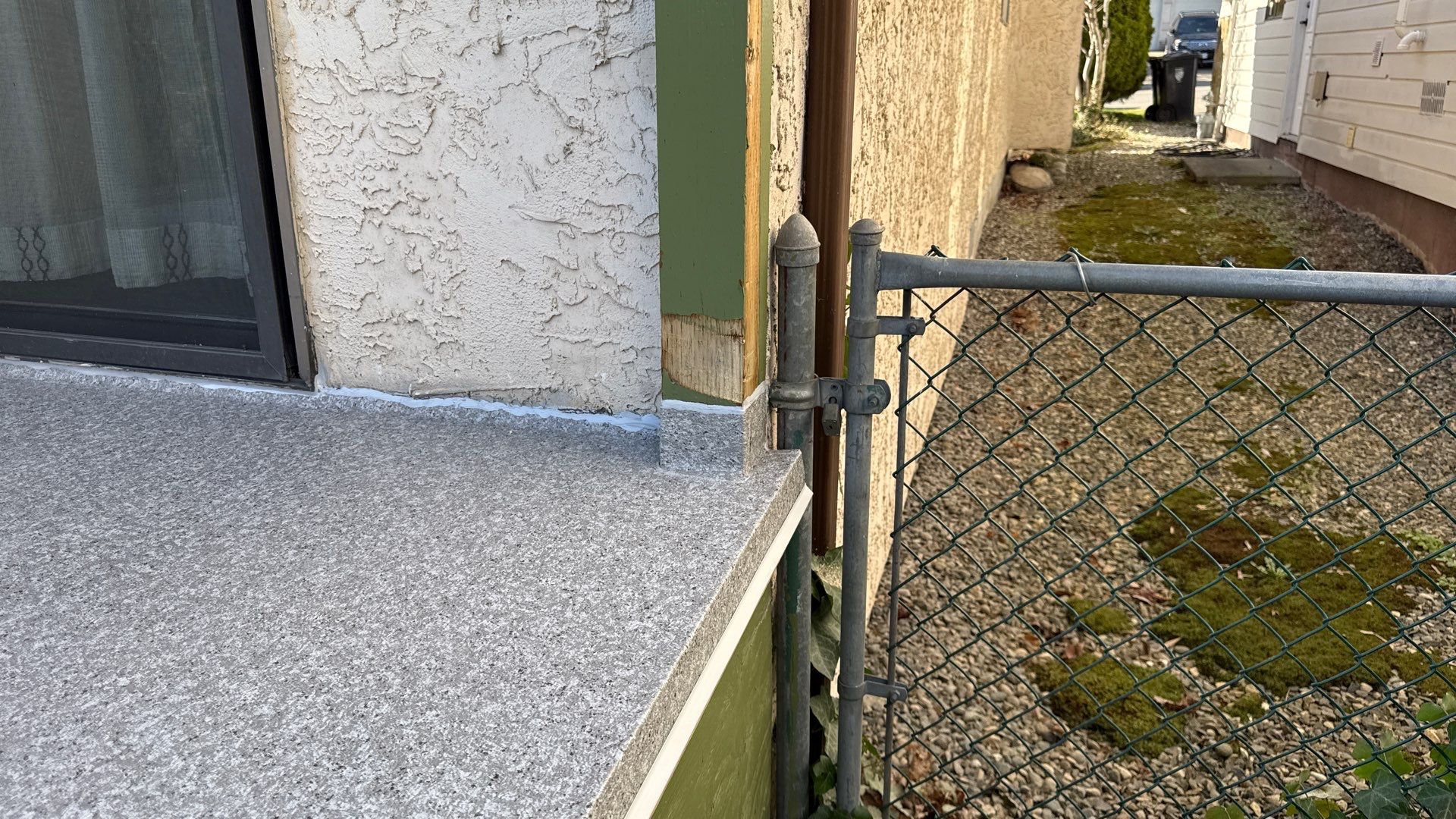 Valordek Grey Stone vinyl decking on a residential deck in summer