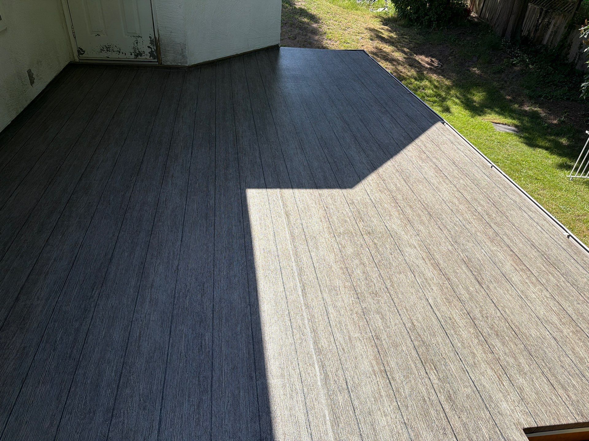 Valordek Walnut Plank vinyl decking membrane on a residential deck