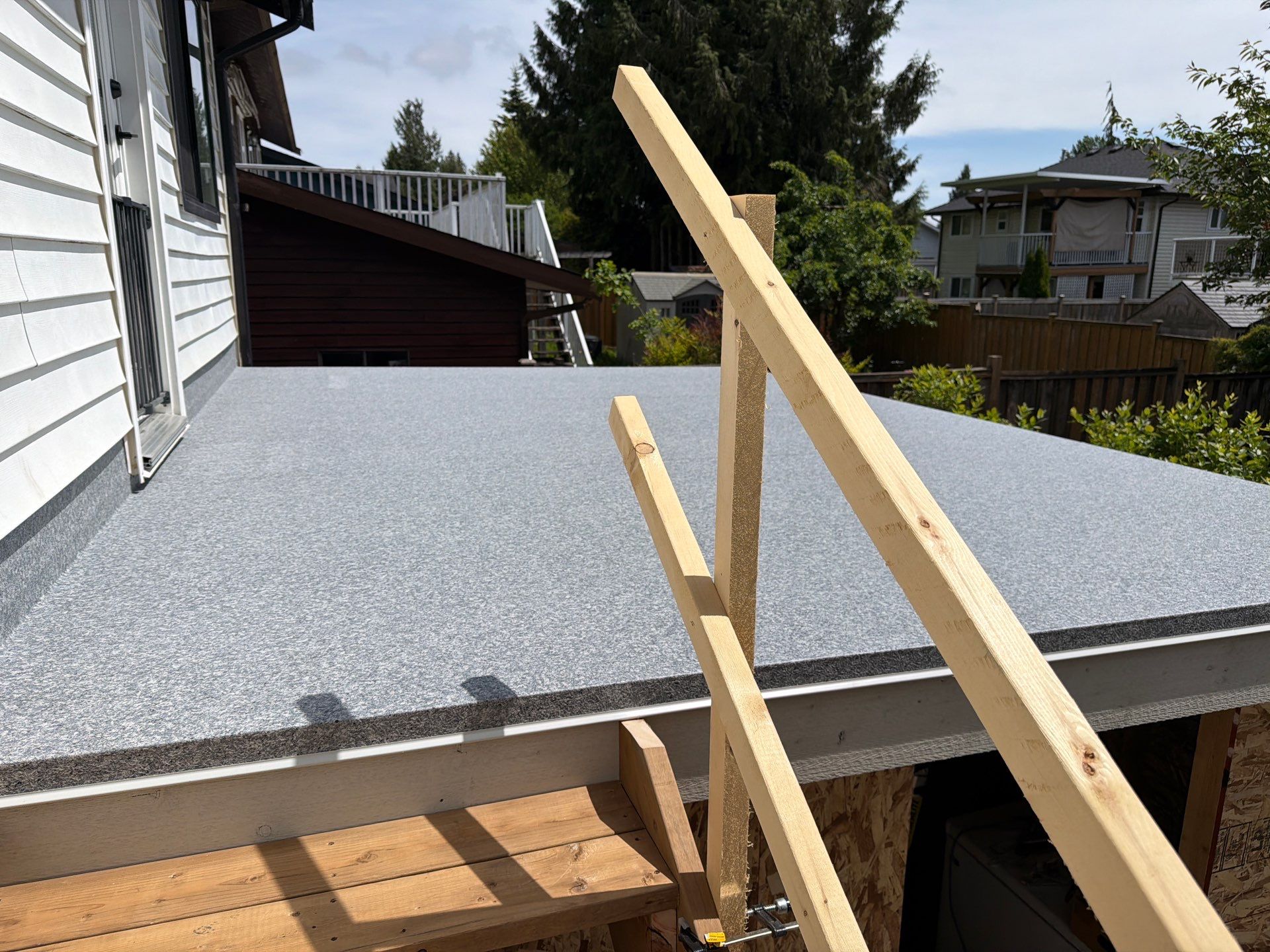 Valordek Grey Stone vinyl decking membrane on a residential deck