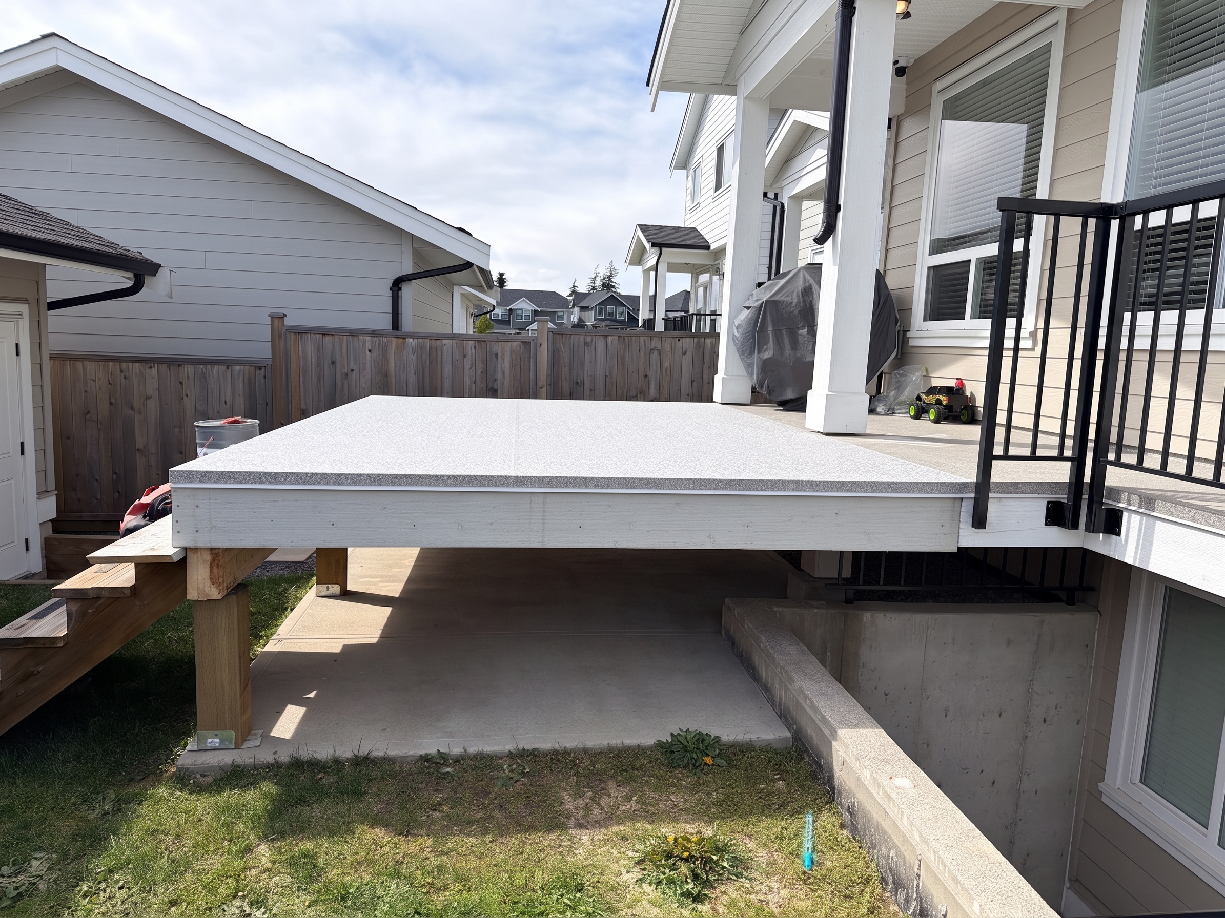 Valordek Grey Stone vinyl decking membrane on a residential deck
