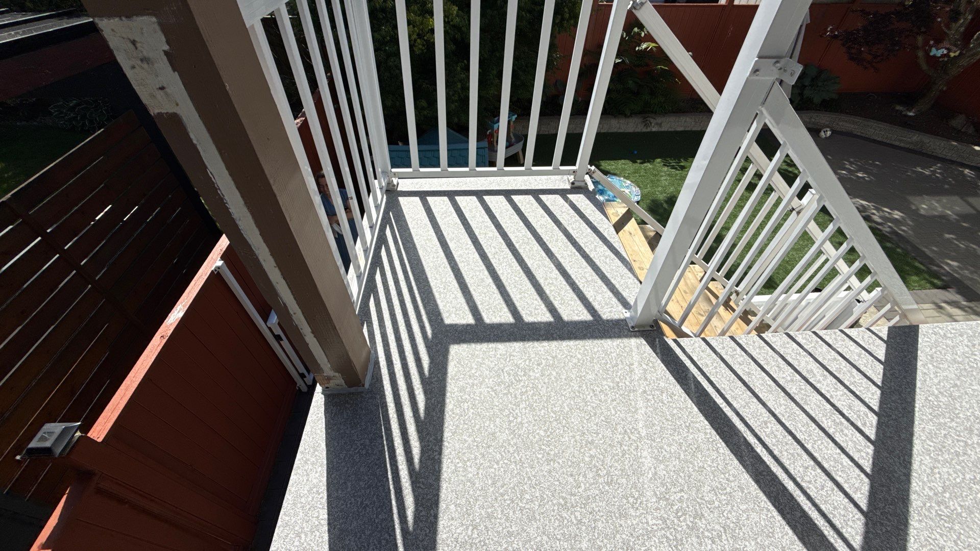 Valordek Flint Taupe vinyl decking membrane on a finished residential deck