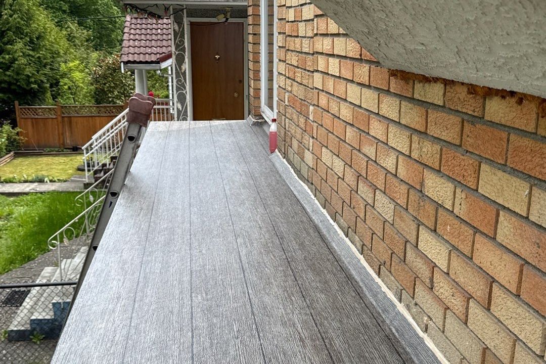 Valordek Walnut Plank vinyl decking membrane Valordek wood-look vinyl decking installed on a residential balcony