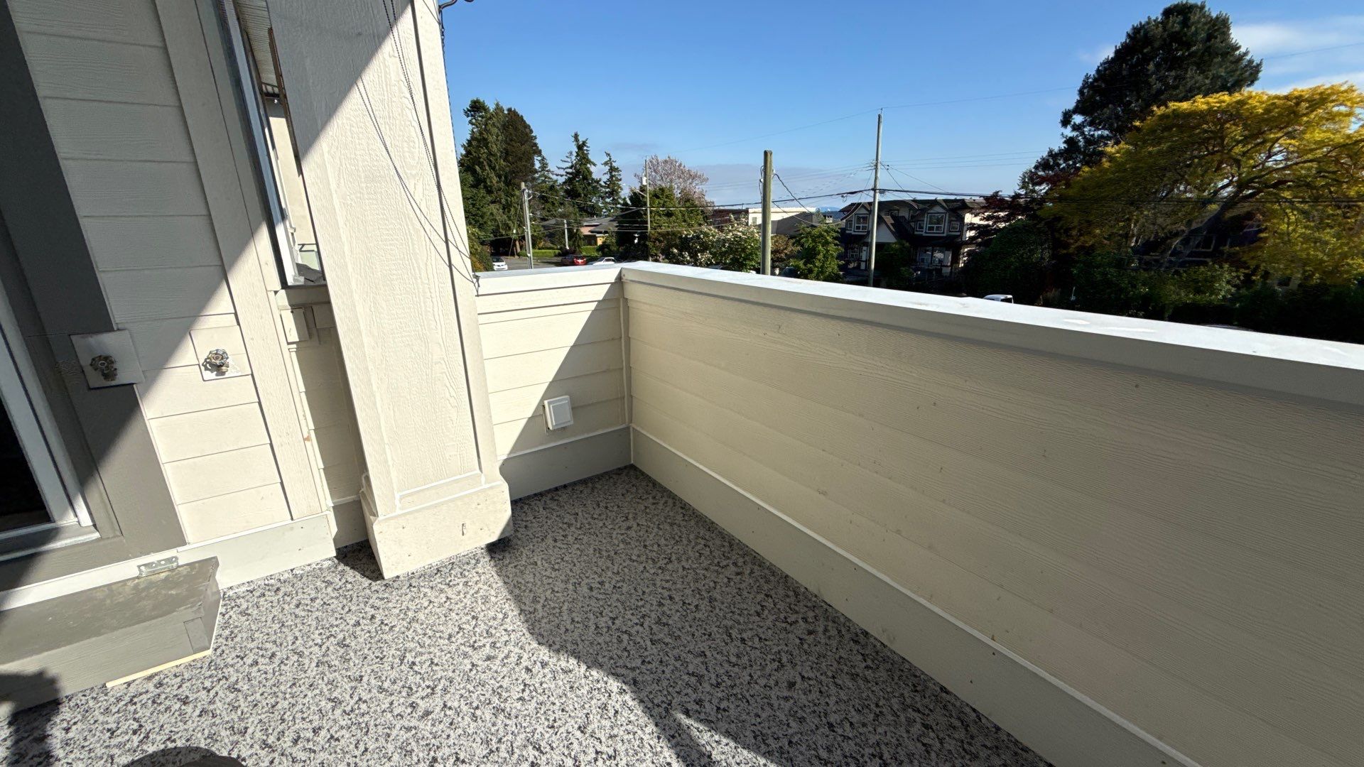 Valordek Madison Grey vinyl decking membrane on a balcony with a solid parapet wall