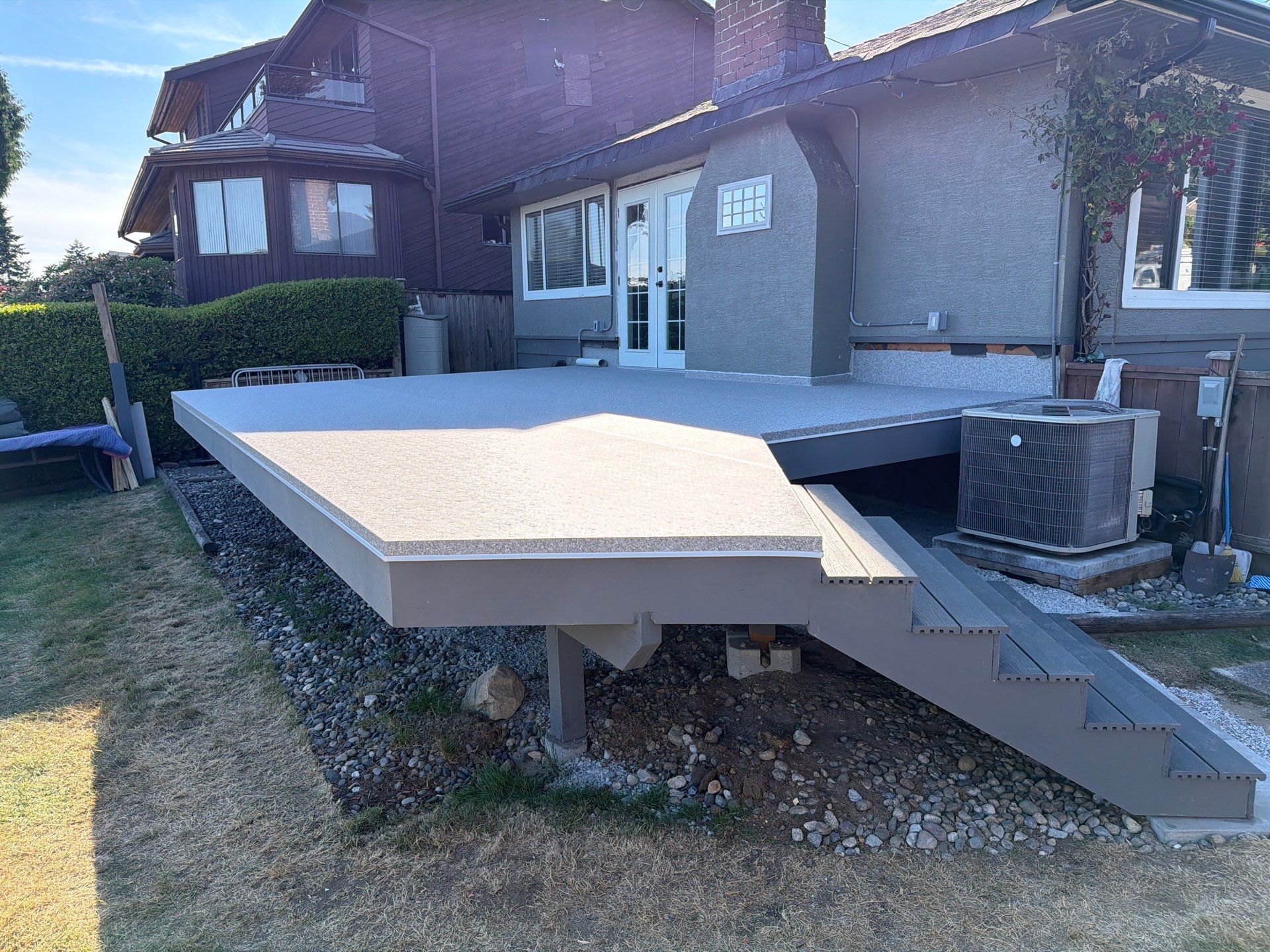 Valordek Grey Stone vinyl decking membrane on a residential deck