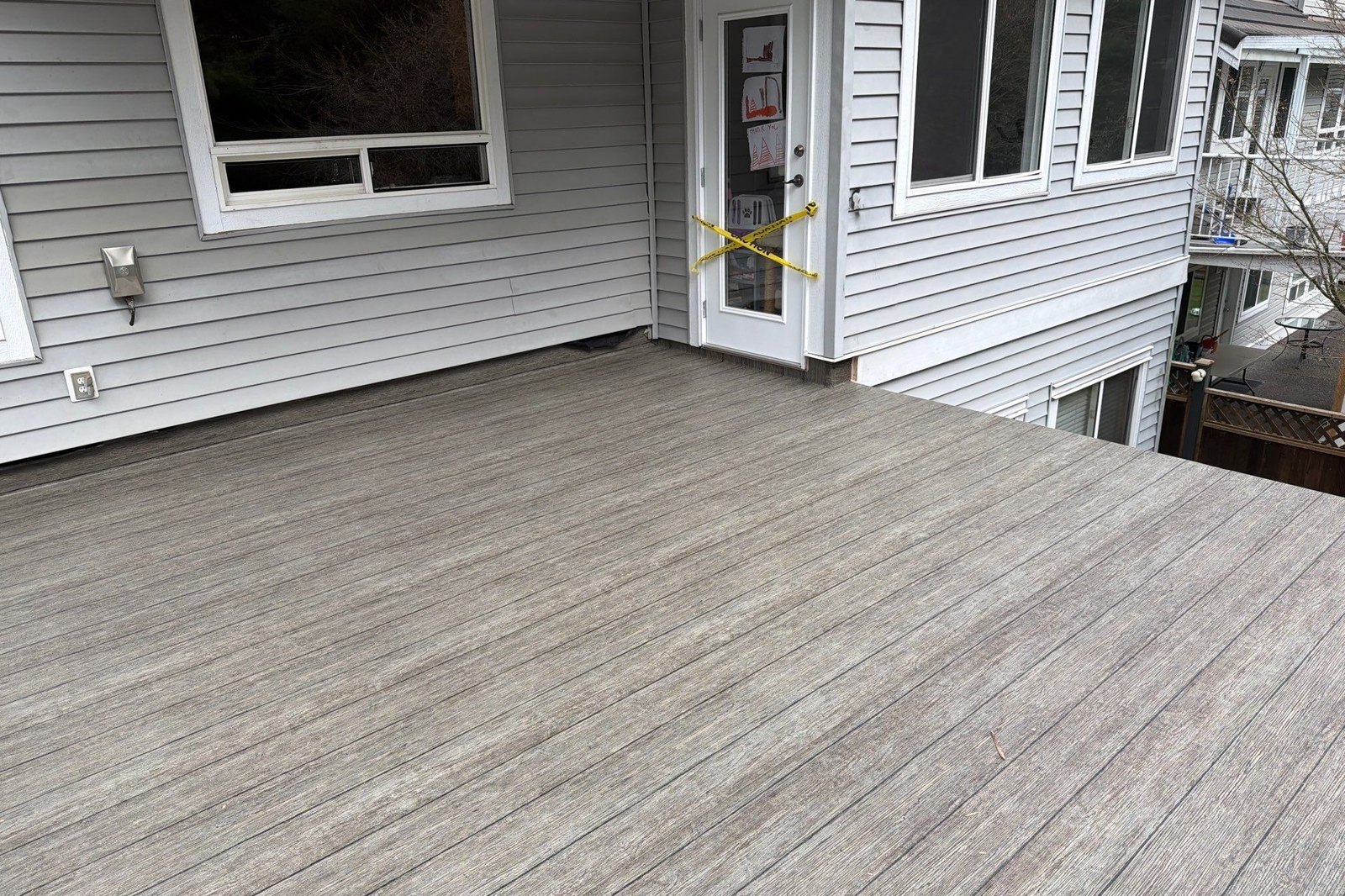 Valordek Walnut Plank vinyl deck membrane Finished vinyl deck in a wood-look pattern on an elevated deck